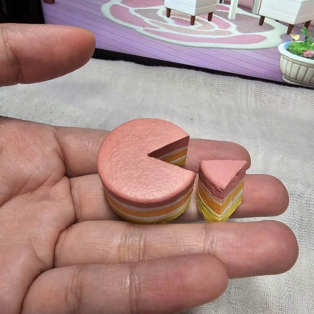 Miniverse Miniature Cake Slice Toy for Play Kitchen or Display (Category: Kids Toys) located in Rizal. Submitted by viviperera (Listing ID 1457325688, Image 2). Description: wyiwyg as is - Adorable miniature cake slice, resembling strawberry and cream cake. - Made from painted wood or similar durable material. - Features a removable slice for interactive play. - Ideal for children's play kitchens and pretend play scenarios. - Also serves as a cha