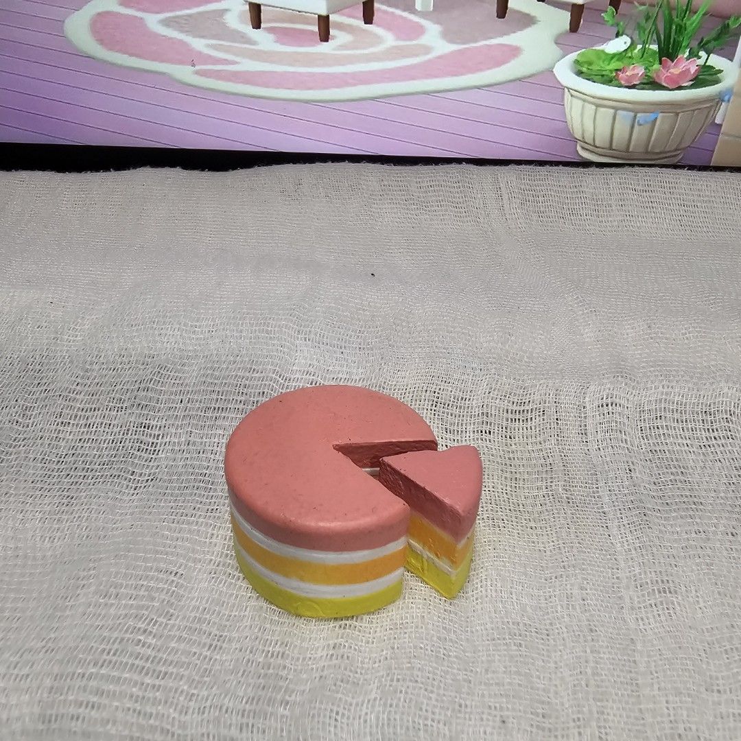 Miniverse Miniature Cake Slice Toy for Play Kitchen or Display (Category: Kids Toys) located in Rizal. Submitted by viviperera (Listing ID 1457325688, Image 1). Description: wyiwyg as is - Adorable miniature cake slice, resembling strawberry and cream cake. - Made from painted wood or similar durable material. - Features a removable slice for interactive play. - Ideal for children's play kitchens and pretend play scenarios. - Also serves as a cha