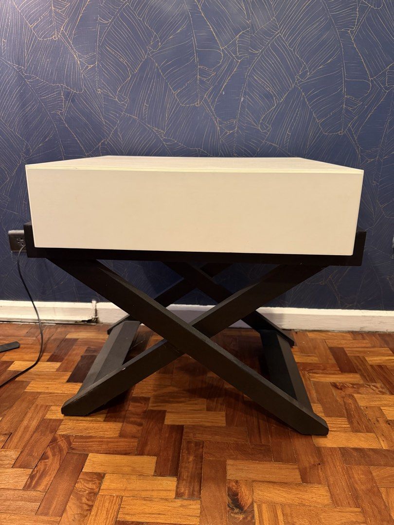 Modern White Top Side Table with Black X-Leg Base (Category: Tables & Sets) located in Paranaque City. Submitted by aaadiz11 (Listing ID 1457216973, Image 1). Description: Selling this stylish modern table with a white cabinet-style top and black X-frame base. Features a soft-close mechanism for smooth and quiet closing. ✨ Condition: Good pre-owned condition 🎨 Color: White & Black 🚪 Feature: Soft-close 🏠 Reason for selling: Decluttering Paymen