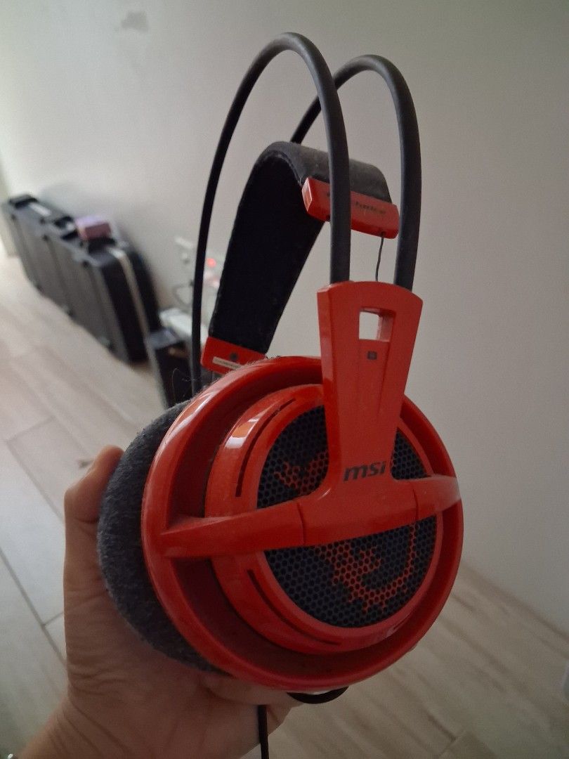 MSI Red Gaming Headphones (Category: Headphones & Headsets) located in Guagua. Submitted by lavieestviah (Listing ID 1457173071, Image 1). Description: - Red MSI Gaming Headphones - Comfortable over-ear design with padded headband - Stylish mesh earcups featuring the MSI logo -Decluttering stuffs - Perfect for immersive gaming sessions or enjoying your favorite music - Shows some signs of wear on the earcups but still WORKING GOOD.