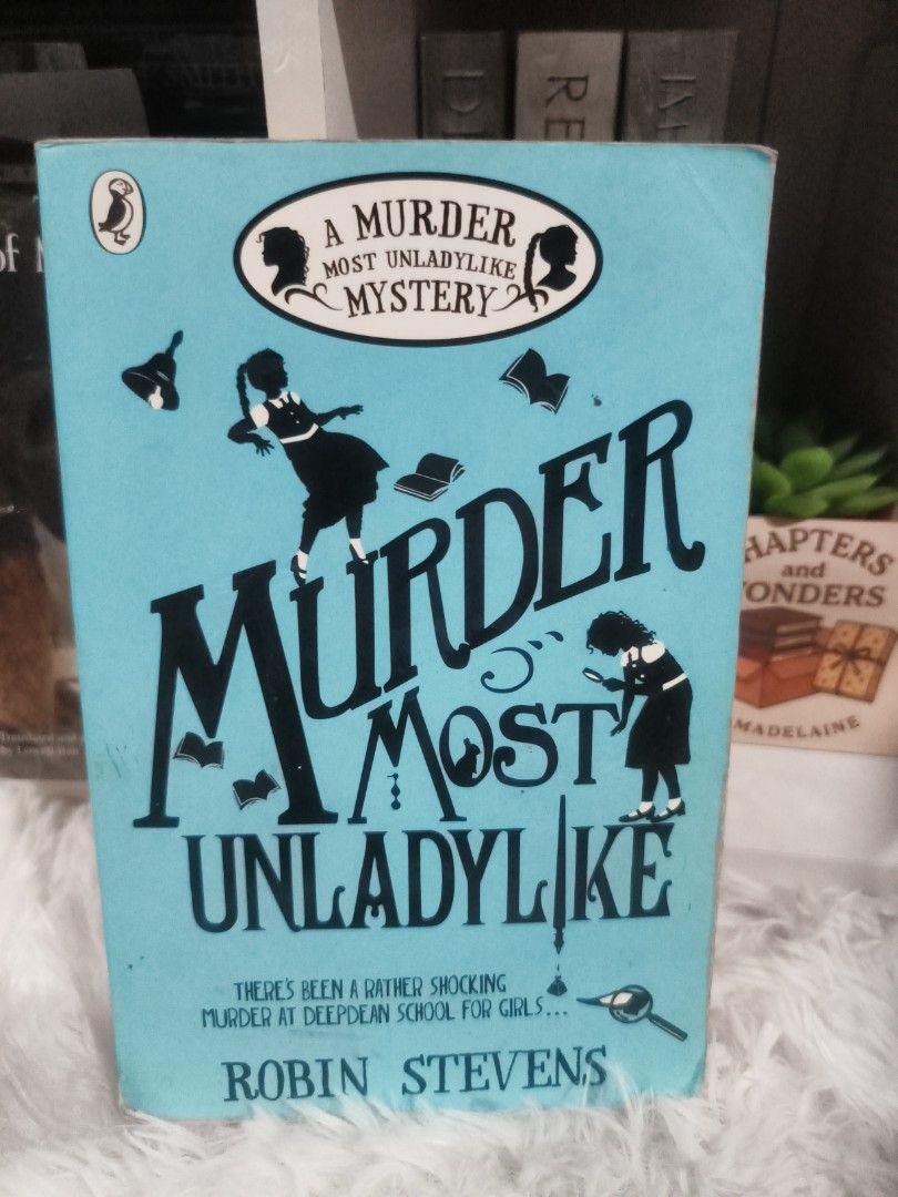 Murder Most Unladylike by Robin Stevens (Category: Storybooks) located in Cabuyao City. Submitted by chaptersandwonders143 (Listing ID 1457209404, Image 1). Description: - Title: Murder Most Unladylike by Robin Stevens - Genre: Mystery novel for young readers - Condition: Pages are yellowed from age - Cover: Some marks on the edges - Spine: Intact - Ideal for: Fans of detective stories.