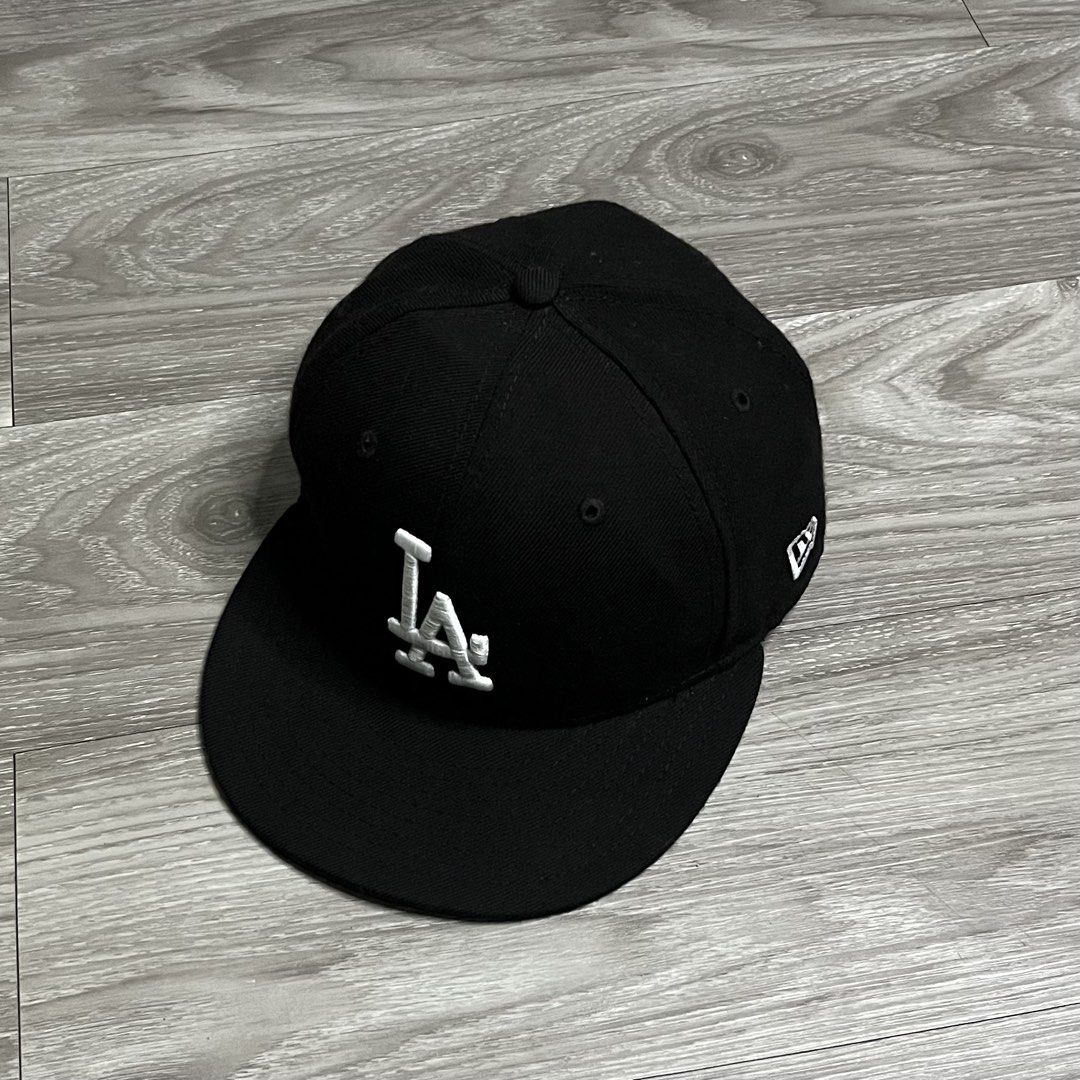 New Era LA Dodgers Black Close Cap (Category: Caps & Hats) located in Cebu City. Submitted by specializedgoodsitem_ (Listing ID 1457317620, Image 2). Description: excellent condition details posted color may vary due to light size 7 1/4.