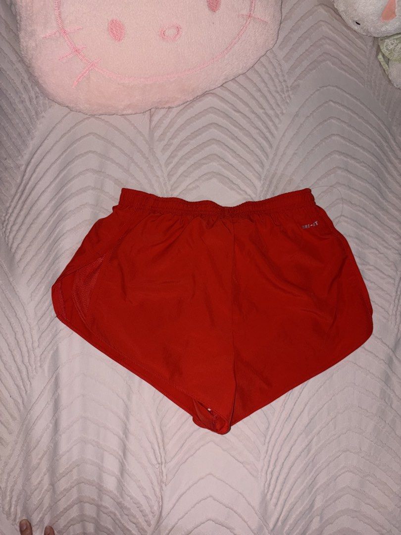 Nike Red Running Shorts (Category: Activewear) located in San Juan City. Submitted by anges_closet (Listing ID 1457181126, Image 2). Description: RFS: too many running shorts - still in very good condition; no issues - mid-low waist cut - short length - drawstring still attached.