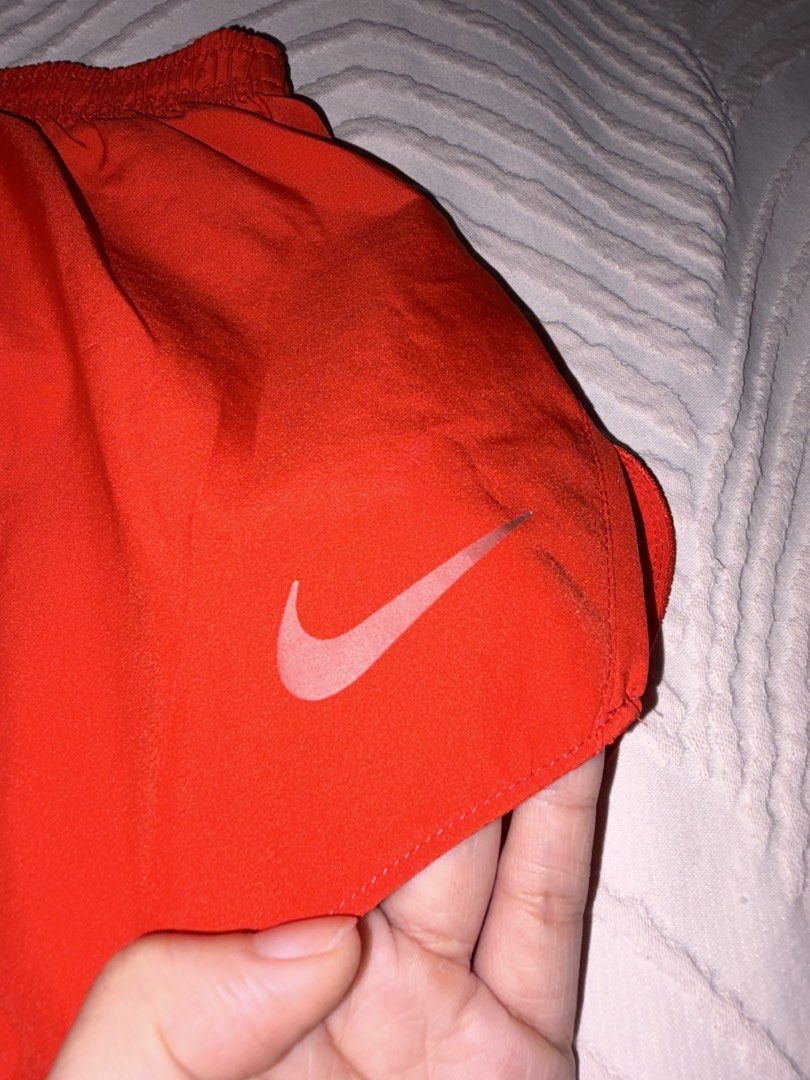 Nike Red Running Shorts (Category: Activewear) located in San Juan City. Submitted by anges_closet (Listing ID 1457181126, Image 3). Description: RFS: too many running shorts - still in very good condition; no issues - mid-low waist cut - short length - drawstring still attached.
