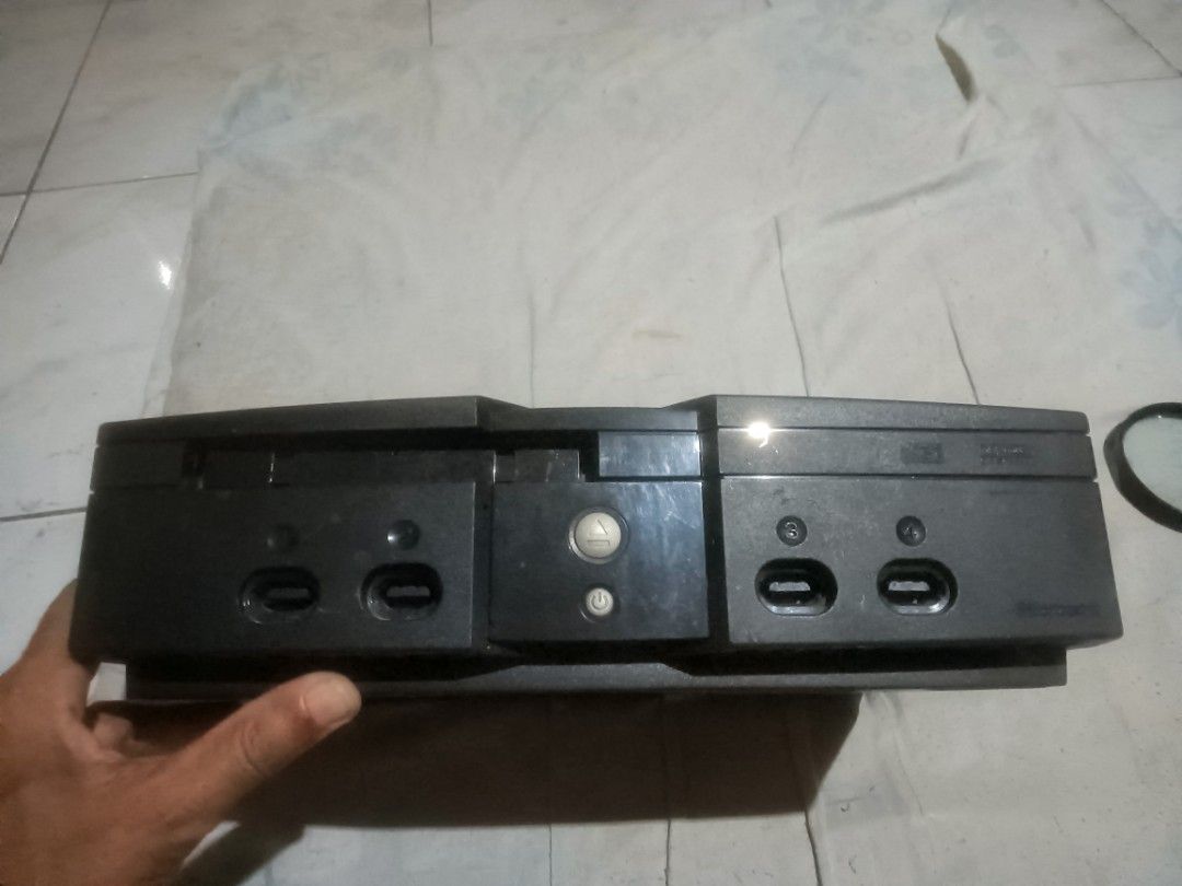 Original Microsoft Xbox Console (Category: Xbox) located in Bulacan. Submitted by carou13325 (Listing ID 1457181173, Image 2). Description: - Original Xbox console - Classic black casing with iconic green Xbox button - Four controller ports on the front - Tested and confirmed working - Ideal for retro gaming enthusiasts and collectors UNTESTED!!! -No Cables to test Good for technicians and collectors .