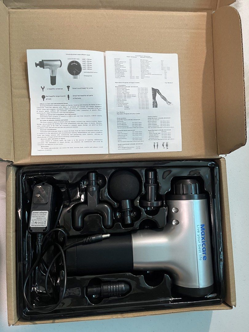 Percussion Massage Gun with Attachments (Category: Massage Devices) located in Makati City. Submitted by humilityandkindness (Listing ID 1457191094, Image 2). Description: - MaxiCare Massage Gun - Multiple attachments for various muscle groups - Includes charger and power adapter - Ideal for post-workout recovery and muscle tension relief - Easy to use and store - Comes in original packaging *Device Type: Handheld percussion massage gun for muscl