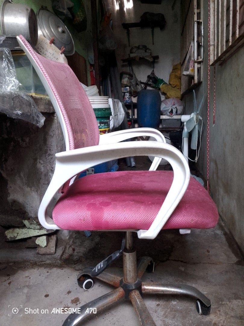 Pink Mesh Office Chair with White Armrests (Category: Office Furniture & Fixtures) located in Manila. Submitted by swiftowl.ce049f (Listing ID 1457164252, Image 3). Description: - Pink mesh back for breathability - Comfortable padded deep pink seat - White armrests - Sturdy metal base with smooth-rolling wheels - Swivels 360 degrees - Minor signs of wear on metal base, does not affect functionality - Ideal for home office, study, or gaming setup 