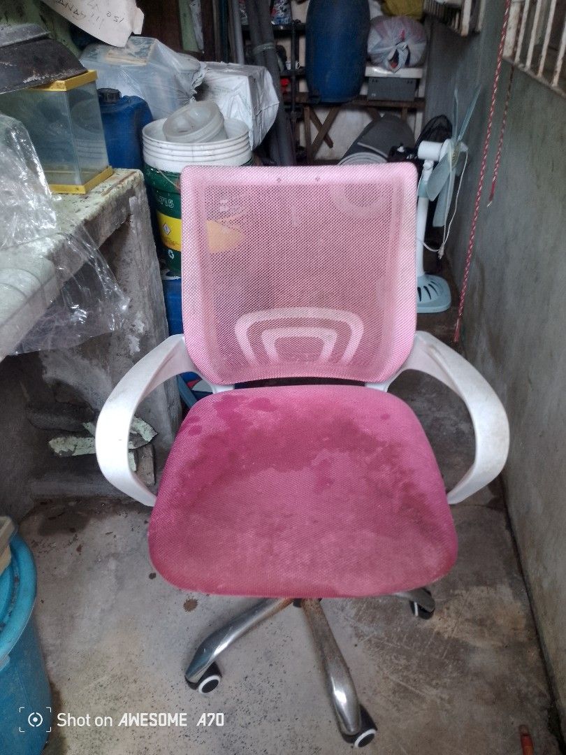 Pink Mesh Office Chair with White Armrests (Category: Office Furniture & Fixtures) located in Manila. Submitted by swiftowl.ce049f (Listing ID 1457164252, Image 1). Description: - Pink mesh back for breathability - Comfortable padded deep pink seat - White armrests - Sturdy metal base with smooth-rolling wheels - Swivels 360 degrees - Minor signs of wear on metal base, does not affect functionality - Ideal for home office, study, or gaming setup 