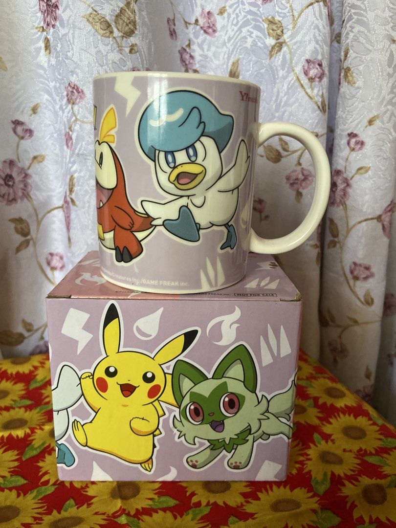 Pokemon SoftBank Y!mobile Collaboration Mug (Category: Coffee & Tea Tableware) located in Davao. Submitted by mengsmixitems (Listing ID 1457154963, Image 2). Description: - Features popular Pokemon: Pikachu, Sprigatito, Fuecoco, and Quaxly. - Includes original packaging. - Ideal for any Pokemon enthusiast. - Perfect for enjoying your morning coffee or tea..