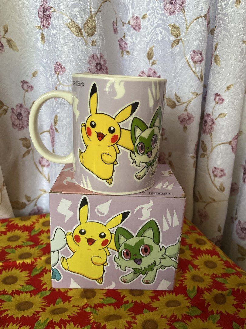 Pokemon SoftBank Y!mobile Collaboration Mug (Category: Coffee & Tea Tableware) located in Davao. Submitted by mengsmixitems (Listing ID 1457154963, Image 3). Description: - Features popular Pokemon: Pikachu, Sprigatito, Fuecoco, and Quaxly. - Includes original packaging. - Ideal for any Pokemon enthusiast. - Perfect for enjoying your morning coffee or tea..