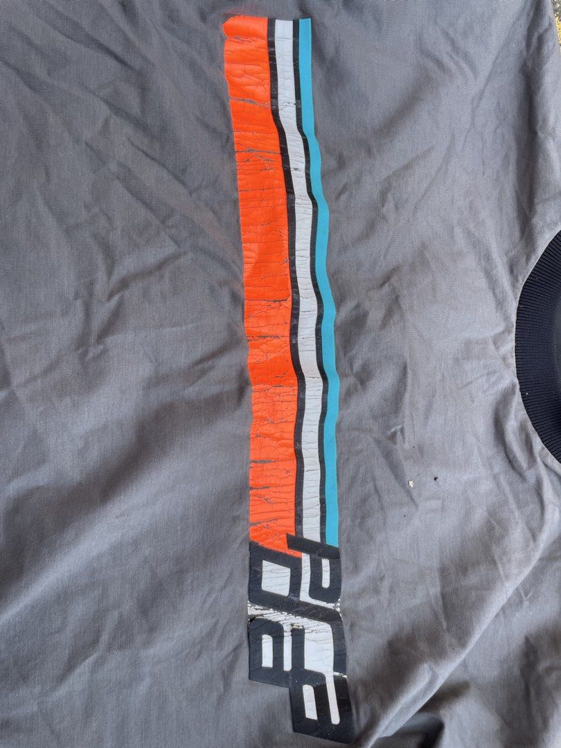 Prada shirt (Category: Luxury Apparel) located in Alegria. Submitted by deniseeee.21 (Listing ID 1457215350, Image 3). Description: flaws: see pictures Size small fit to large and xl crack prints.