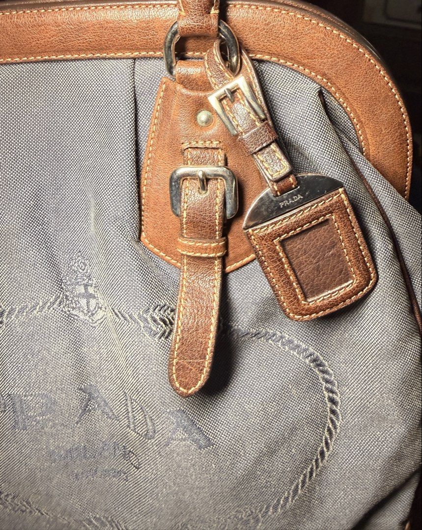 Prada Vintage Handbag (Category: Luxury Bags & Wallets) located in Manila. Submitted by rewrn.mnl (Listing ID 1457249993, Image 3). Description: Prada BR3682 Denim and Cocco Logo Jacquard Handbag Php 20,000 Authentic No dust bag included Minor flaw: Slight yellowish stain on the canvas, barely noticeable.