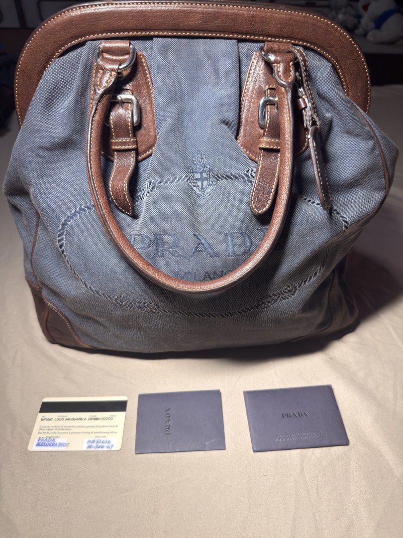 Prada Vintage Handbag (Category: Luxury Bags & Wallets) located in Manila. Submitted by rewrn.mnl (Listing ID 1457249993, Image 2). Description: Prada BR3682 Denim and Cocco Logo Jacquard Handbag Php 20,000 Authentic No dust bag included Minor flaw: Slight yellowish stain on the canvas, barely noticeable.