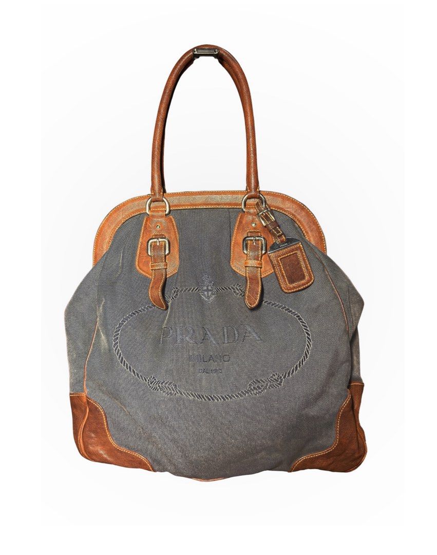 Prada Vintage Handbag (Category: Luxury Bags & Wallets) located in Manila. Submitted by rewrn.mnl (Listing ID 1457249993, Image 1). Description: Prada BR3682 Denim and Cocco Logo Jacquard Handbag Php 20,000 Authentic No dust bag included Minor flaw: Slight yellowish stain on the canvas, barely noticeable.