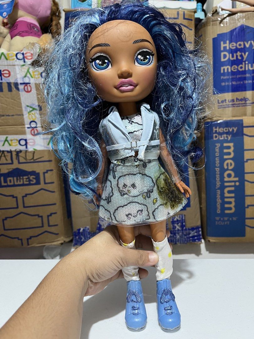 Rainbow High Dolls - Blue & Rainbow Hair (Category: Kids Toys) located in Bugallon. Submitted by aennleeza (Listing ID 1457161288, Image 2). Description: - Two Rainbow High dolls sold as a set. - Doll 1: Blue hair, light blue jacket, patterned skirt. - Doll 2: Multi-colored hair, black crop top, sparkly skirt. - Both dolls feature colorful socks and boots. - Selling as a pair, as seen in photos..