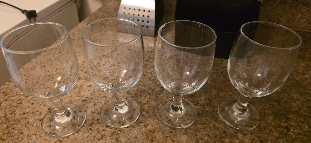 Set of 4 Clear Wine Glasses (Category: Dinnerware & Cutlery) located in Manila. Submitted by cher0918 (Listing ID 1457169863, Image 1). Description: - Set of 4 clear wine glasses - Ideal for parties or everyday use - Features sturdy stems - Ready for a new home - Pick up only.