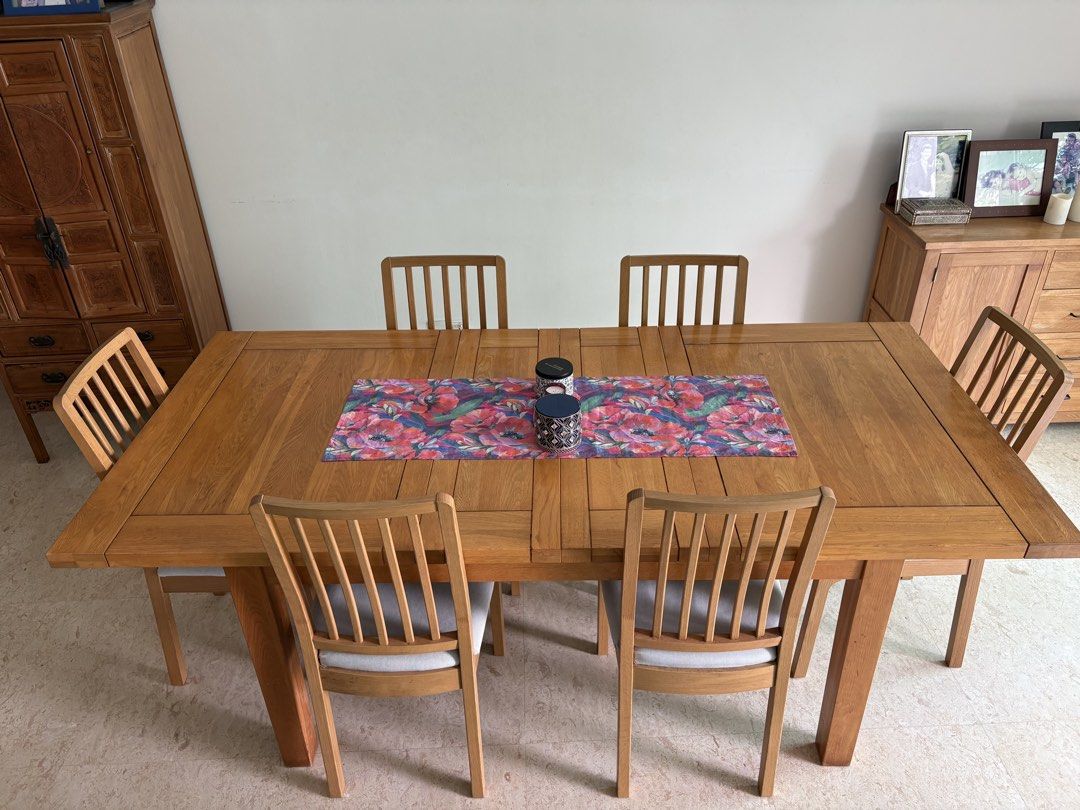 Solid Wood Dining Table with 6 dining chairs (Category: Tables & Sets) located in Singapore. Submitted by minky.h (Listing ID 1457213605, Image 2). Description: Solid Wood Dining Table, some slight signs of wear and tear but in very condition. 150 cm x 100 cm Height 76 cm When extended Table 210 cm x 100cm Height 76 cm Six dining chairs, in excellent condition, with removable, washable seat covers. .