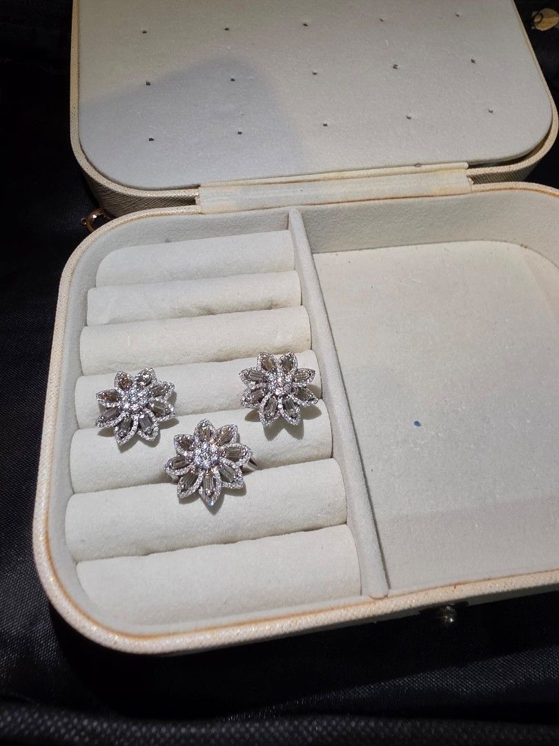 Sparkling Flower Stud Earrings with Baguette diamonds (Category: Earrings) located in Quezon City. Submitted by mineg (Listing ID 1457234670, Image 2). Description: - Eye-catching flower-shaped stud earrings in white gold - Features a central cluster of round diamonds - Surrounded by baguette-cut diamonds for extra sparkle. - Intricate and glamorous design. - Perfect for elevating any outfit. - 14 Karat gold negotiable.