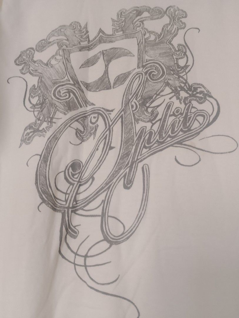 Split Graphic T-Shirt — Size M (Category: Tshirts & Polo Shirts ) located in Lapu Lapu. Submitted by infinit8 (Listing ID 1457186606, Image 3). Description: Split Graphic T-Shirt — Size M Split graphic tee featuring an intricate Western/cowboy-inspired design with the Split logo and detailed linework. - Brand: Split - Size: Medium (M) - Made in Mexico - White - Short sleeve - Crew neck - Double-stitched hems - Unique graphic print Condition: Pre-