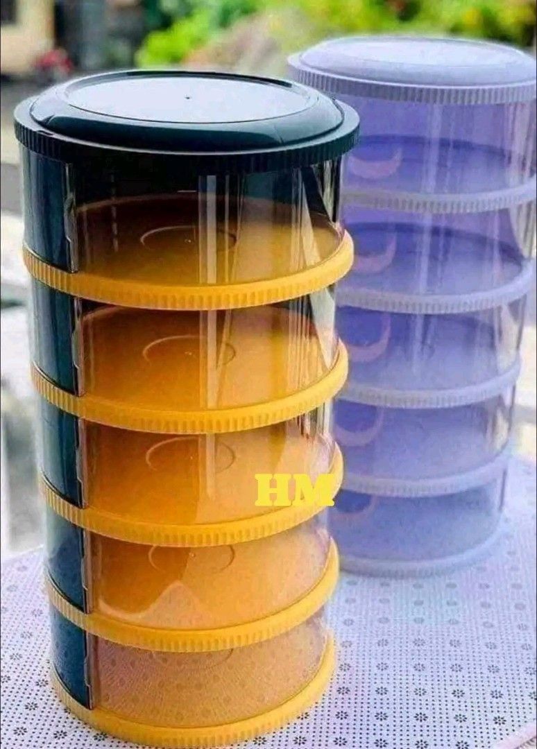 Stackable Tiered Storage Container Organizer (Category: Storage Boxes & Baskets) located in Manila. Submitted by marvieobordo (Listing ID 1457282853, Image 2). Description: - Stackable tiered storage container for versatile organization. - Perfect for storing snacks, fruits, or small items. - Effortless assembly and disassembly. - Stylish design complements any countertop or table. - Available in two color options: yellow/black and purple/white..