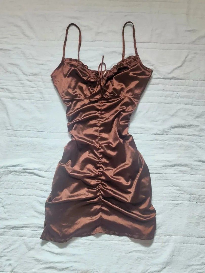 Take All 4 Assorted Dresses: Brown Satin, Leopard Print, Puff Sleeve (Category: Dresses) located in Quezon City. Submitted by alluring.avenue (Listing ID 1457211630, Image 3). Description: - Brown satin ruched mini dress with spaghetti straps - Brown puff-sleeve square neck dress with sheer overlay - Sleeveless leopard print mini dress - Brown pinafore-style dress with cream bell-sleeve top All are super cute styles!.