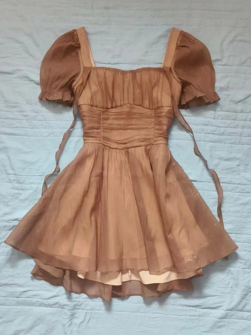 Take All 4 Assorted Dresses: Brown Satin, Leopard Print, Puff Sleeve (Category: Dresses) located in Quezon City. Submitted by alluring.avenue (Listing ID 1457211630, Image 2). Description: - Brown satin ruched mini dress with spaghetti straps - Brown puff-sleeve square neck dress with sheer overlay - Sleeveless leopard print mini dress - Brown pinafore-style dress with cream bell-sleeve top All are super cute styles!.