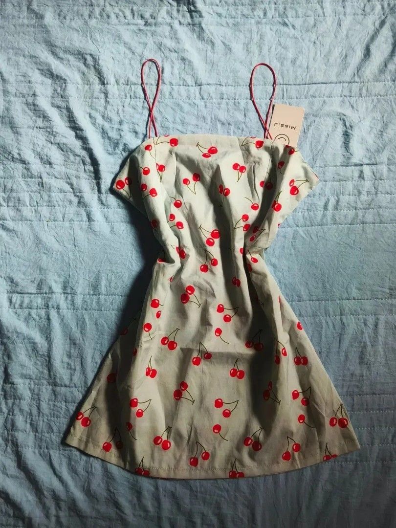 Take All Cute Floral & Cherry Print Dresses (Category: Dresses) located in Quezon City. Submitted by alluring.avenue (Listing ID 1457211105, Image 3). Description: - Bundle of 4 dresses - Features floral and cherry prints - Some with tie-up details and lace trim - Ideal for summer or casual wear - Sold as a set.