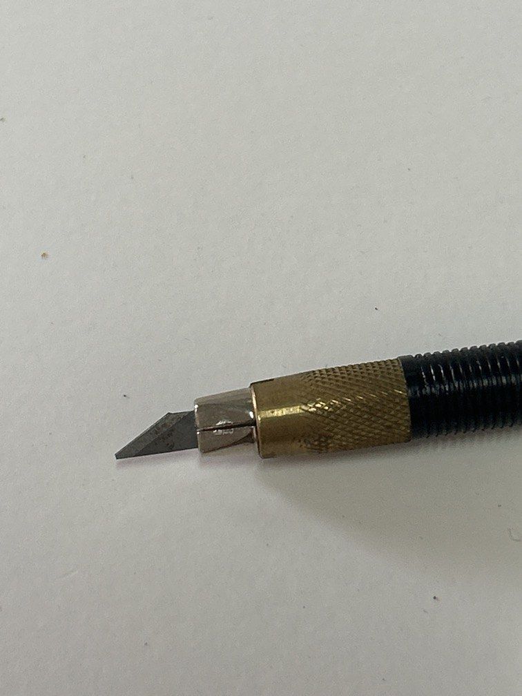 Tamiya Design Knife (Item 74020) (Category: Stationery & School Supplies) located in Bulacan. Submitted by ourdailybreads (Listing ID 1457170560, Image 3). Description: Tamiya Design Knife (Item 74020) featuring a slim black pen-style handle with gold lettering and a translucent protective cap..