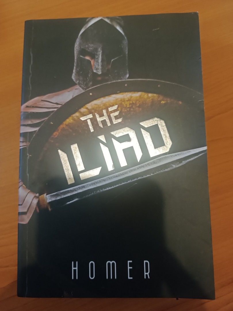 The Iliad by Homer (Category: Storybooks) located in Las Pinas. Submitted by mitchmiko16 (Listing ID 1457148312, Image 1). Description: - Classic epic poem by Homer - Features striking cover art with a Spartan warrior - A must-have for literature enthusiasts and history buffs - Great for reading or display.