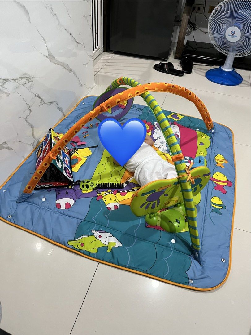 Tiny Love Play Gym (Category: Infant Playtime) located in Rodriguez. Submitted by aubreysee (Listing ID 1457309358, Image 1). Description: - Fun play gym for babies - Colorful waterproof sensory mat - Overhead arch with hanging toys for reaching and grabbing - Ideal for tummy time and sensory development - four corners can be enclosed - Easy to set up and store - has music and lights Used only a few times since we moved and didn’t have space but 
