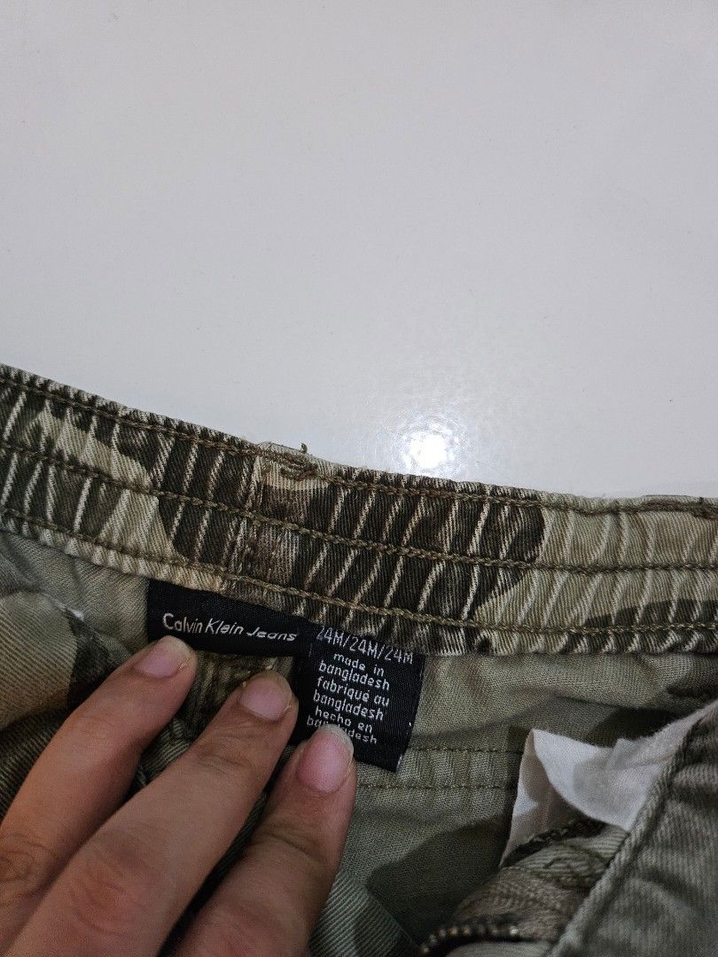 Toddler Pants and Shorts (Category: Babies & Kids Fashion) located in Mandaluyong City. Submitted by efril.pecson (Listing ID 1457244987, Image 3). Description: - Bundle of 3 boys' shorts - Includes: Calvin Klein Jeans camouflage cargo shorts (size 24M) - Also includes: White cargo shorts with blue stitching - And: Red shorts with a crab graphic - Ideal for summer play.