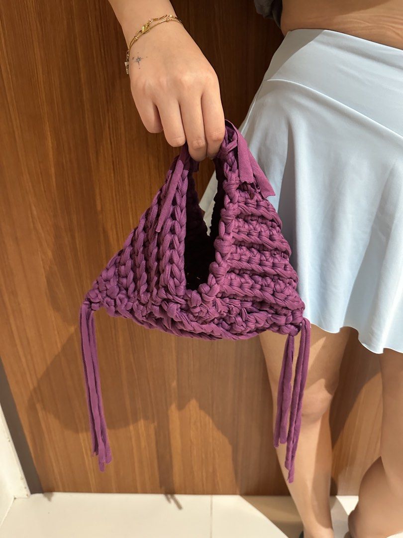 Triangle Hand Bag Crochet (handmade) - Ube Color (Category: Purses & Pouches) located in San Juan City. Submitted by channiesara3 (Listing ID 1457287009, Image 2). Description: Handmade crocheted hand bag made by instag: @niks_knackshop Inspired by LOOSENDS crochet - Material: T-shirt yarn (smooth but stretchy material) - Color: Violet/Ube - Size: small (check photos with iPhone 14 pro max inside the bag as reference) - fairly spacious for a smal