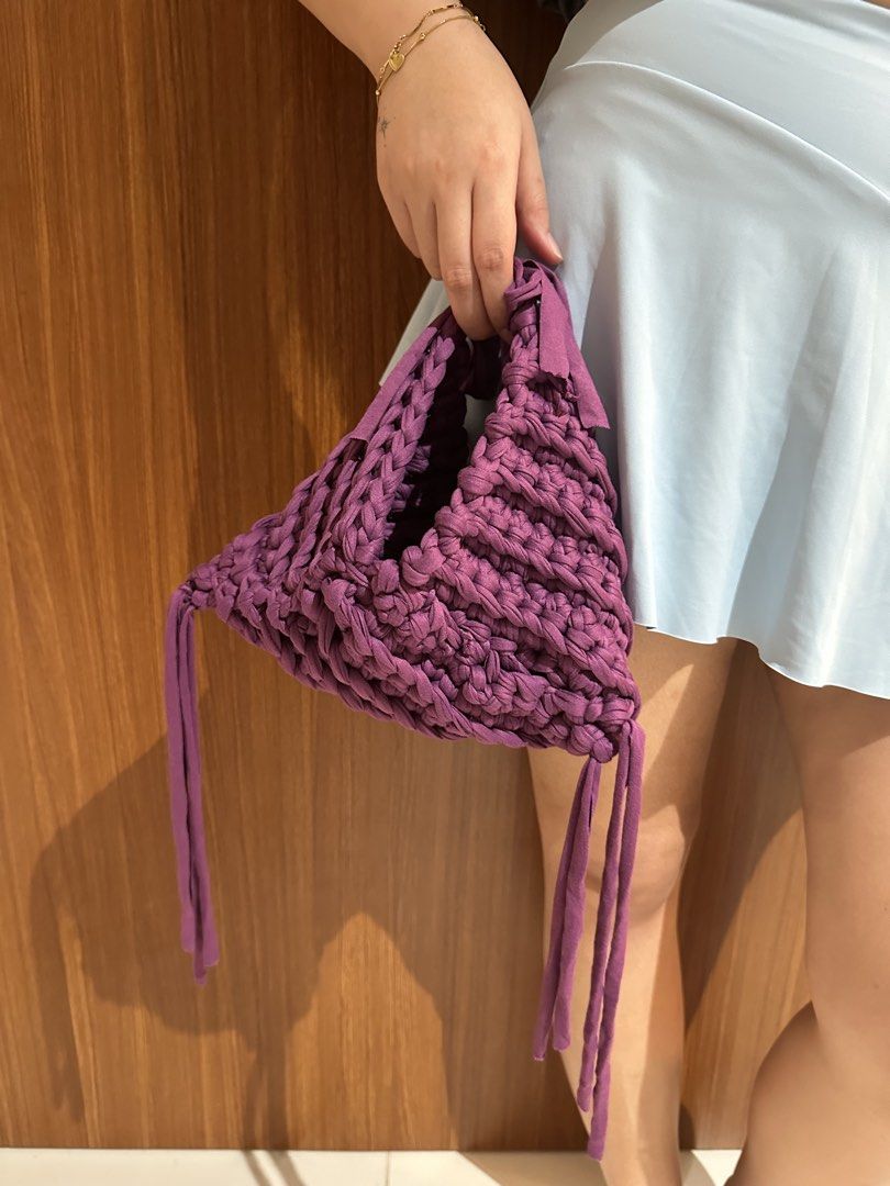 Triangle Hand Bag Crochet (handmade) - Ube Color (Category: Purses & Pouches) located in San Juan City. Submitted by channiesara3 (Listing ID 1457287009, Image 1). Description: Handmade crocheted hand bag made by instag: @niks_knackshop Inspired by LOOSENDS crochet - Material: T-shirt yarn (smooth but stretchy material) - Color: Violet/Ube - Size: small (check photos with iPhone 14 pro max inside the bag as reference) - fairly spacious for a smal
