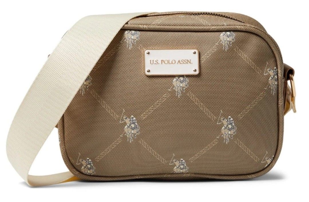 U.S. Polo Assn. Crossbody Bag (Category: Cross-body Bags) located in Manila. Submitted by cacnammon (Listing ID 1457189363, Image 1). Description: - Brand: U.S. Polo Assn. - Color: Brown/Beige - Style: Crossbody bag - Features: Signature monogram pattern all over - Compartments: Main zippered compartment with an inner pocket - Strap: Adjustable - Condition: Brand new with original tags attached - Ideal for: Everyday use.