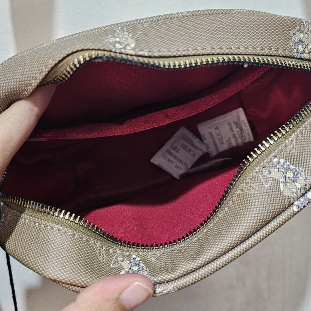 U.S. Polo Assn. Crossbody Bag (Category: Cross-body Bags) located in Manila. Submitted by cacnammon (Listing ID 1457189363, Image 3). Description: - Brand: U.S. Polo Assn. - Color: Brown/Beige - Style: Crossbody bag - Features: Signature monogram pattern all over - Compartments: Main zippered compartment with an inner pocket - Strap: Adjustable - Condition: Brand new with original tags attached - Ideal for: Everyday use.