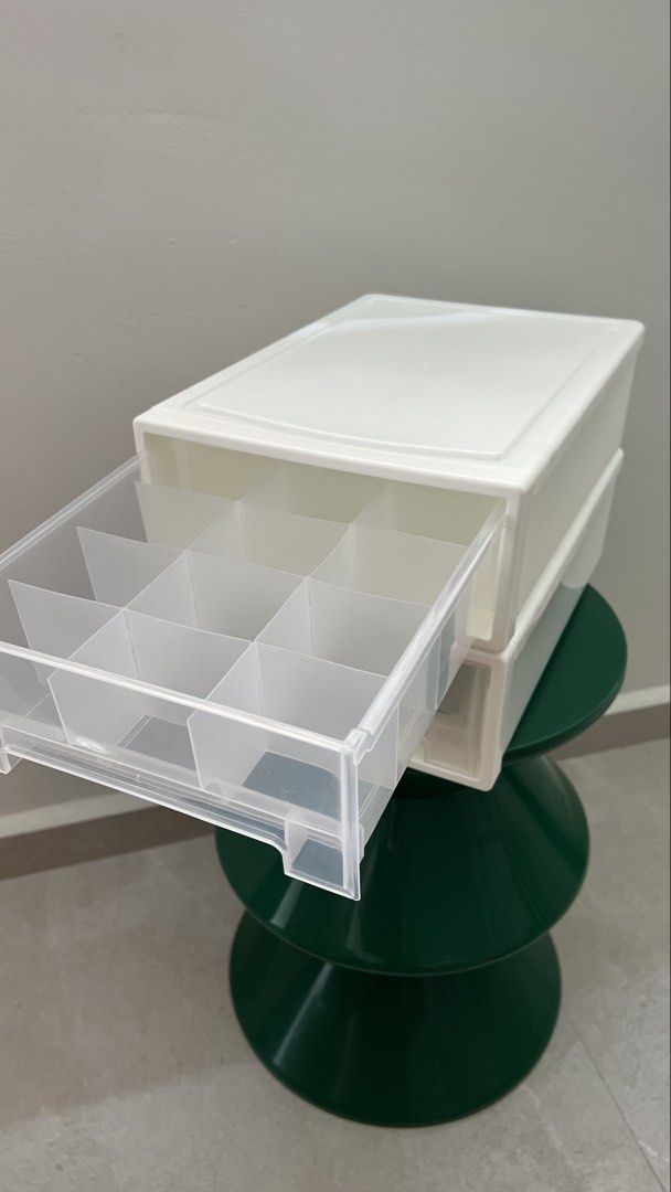 White Stackable Storage Drawers with Compartments (Category: Storage Boxes & Baskets) located in Singapore. Submitted by ian_so_common (Listing ID 1457220401, Image 2). Description: - Two white storage drawers - Stackable design - Internal dividers in each drawer - Ideal for organizing stationery, makeup, accessories, sock, undergarments, etc. - Helps keep desks and vanities tidy - Easy to open and close - socks for scale, not included - $5 each,