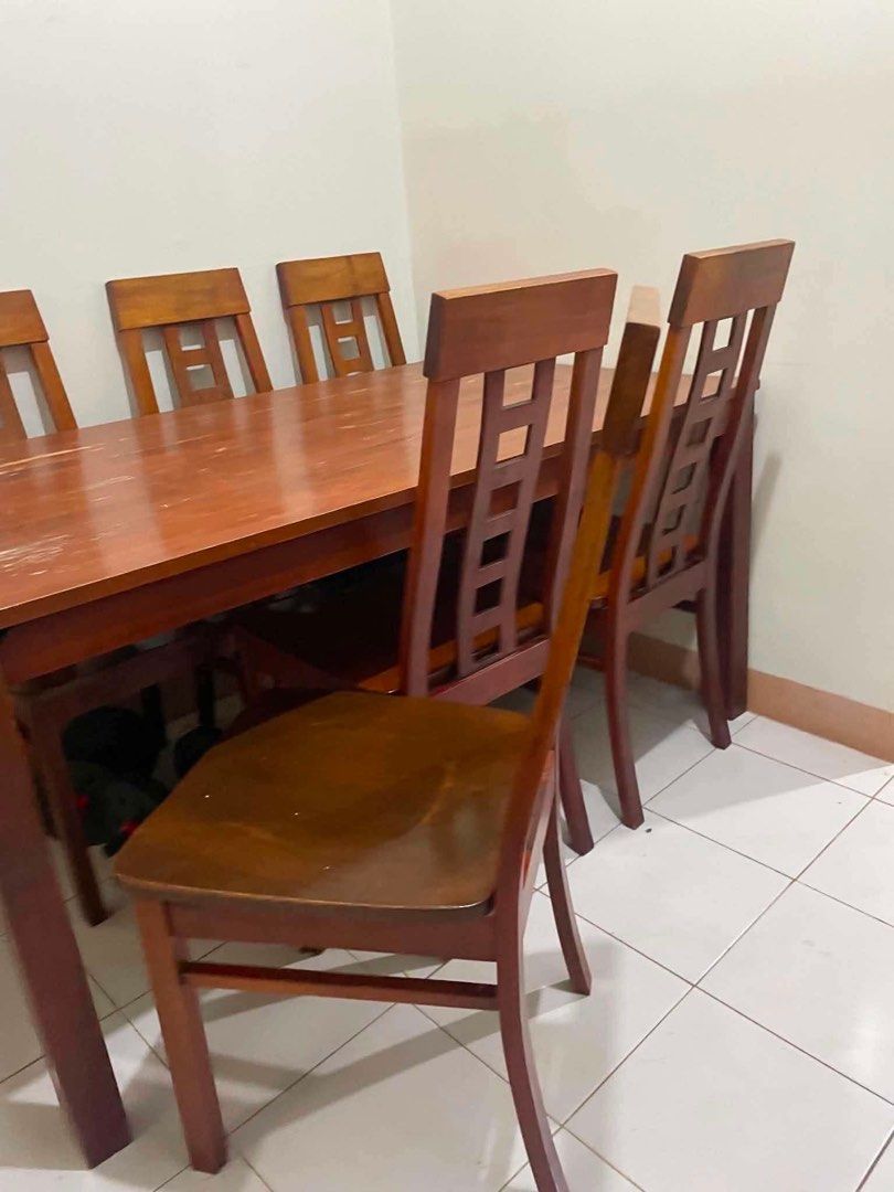 Wooden Dining Table with 6 Chairs (Category: Tables & Sets) located in Manila. Submitted by shimishimi_kokobop (Listing ID 1457172774, Image 3). Description: - Wooden dining table with a warm, brown finish - Includes 6 classic chairs with slatted backs - Ideal for family meals and gatherings - Ready for its new home RUSH SALE! 🇮🇹 6-SEATER WOODEN DINING SET — ₱7,000 🪑🍽️ Original from Italy 🇮🇹 Selling our 6-Seater Wooden Dining Set — 1 dining