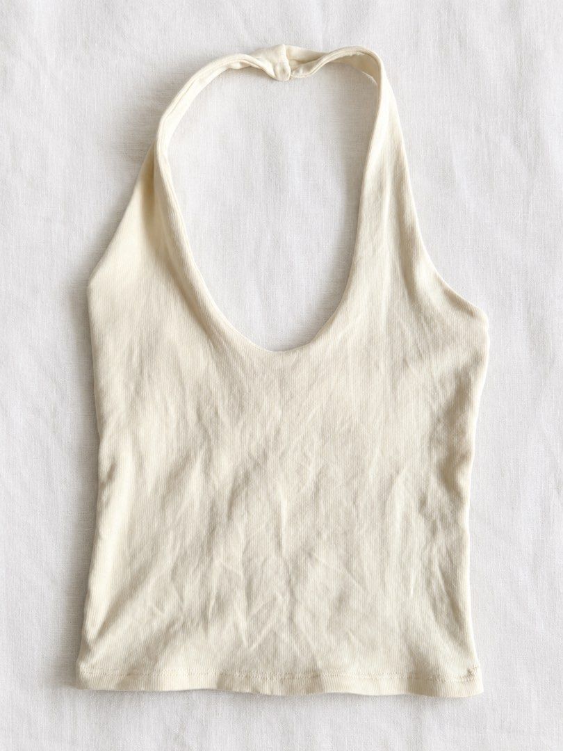 zara butter yellow halter top (Category: Sleeveless) located in Rizal. Submitted by z00vi (Listing ID 1456666199, Image 3). Description: - cut wash tag, but still with brand tag - bust area is double lined - small rip in front (sewn over already, see pics).