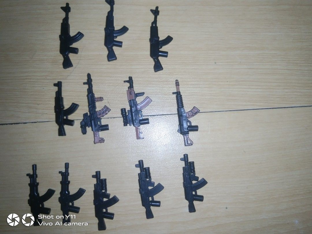 22-Piece Custom Lego AK Rifle Weapon Pack (Category: Lego & Building Sets) located in Manila. Submitted by legofigures_813 (Listing ID 1457429088, Image 3). Description: ​22-Piece Custom Lego AK Rifle Weapon Pack (LEGO Compatible) ​Selling a lot of 22 custom AK-style assault rifles for minifigures. Great for military MOCs, custom soldier builds, or gearing up an army. ​Includes 22 Guns Total: ​Modern Tactical AKs (with scopes, laser sights, & und
