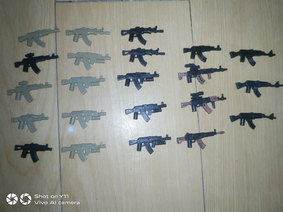 22-Piece Custom Lego AK Rifle Weapon Pack (Category: Lego & Building Sets) located in Manila. Submitted by legofigures_813 (Listing ID 1457429088, Image 1). Description: ​22-Piece Custom Lego AK Rifle Weapon Pack (LEGO Compatible) ​Selling a lot of 22 custom AK-style assault rifles for minifigures. Great for military MOCs, custom soldier builds, or gearing up an army. ​Includes 22 Guns Total: ​Modern Tactical AKs (with scopes, laser sights, & und