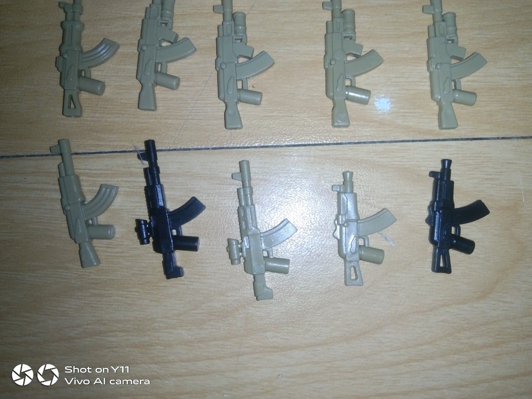 22-Piece Custom Lego AK Rifle Weapon Pack (Category: Lego & Building Sets) located in Manila. Submitted by legofigures_813 (Listing ID 1457429088, Image 2). Description: ​22-Piece Custom Lego AK Rifle Weapon Pack (LEGO Compatible) ​Selling a lot of 22 custom AK-style assault rifles for minifigures. Great for military MOCs, custom soldier builds, or gearing up an army. ​Includes 22 Guns Total: ​Modern Tactical AKs (with scopes, laser sights, & und