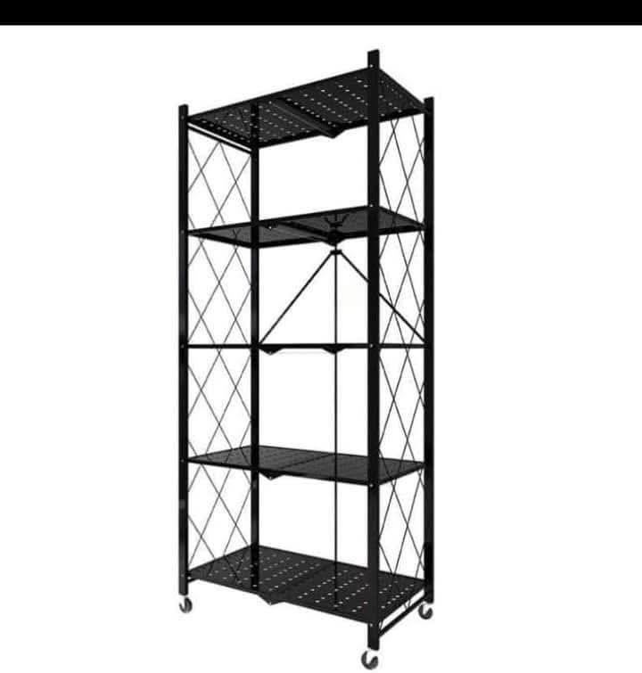 4-Tier Folding Kitchen Shelf Rack with Wheels (Category: Shelves, Cabinets & Racks) located in Manila. Submitted by jhonlexlim0517 (Listing ID 1457509248, Image 2). Description: - 4-Tier Folding Shelf - Ideal for Kitchen Storage (Microwave, Pots, Pans, etc.) - Built-in Wheels for Easy Mobility - Folds Flat for Compact Storage - Dimensions: 122cm (Height) x 71cm (Width) x 34cm (Depth) - Shelf Heights: 37cm, 34cm, 34cm.