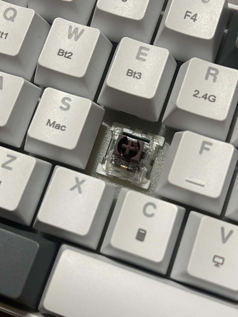 60% Mechanical Keyboard with RGB Backlighting (Category: Computer Keyboard) located in Caloocan City. Submitted by ursweetgal (Listing ID 1457372527, Image 2). Description: - Compact 60% mechanical keyboard - Stylish white and grey keycaps - Connect to multiple devices via Bluetooth (Bt1, Bt2, Bt3) - Fast 2.4G wireless connection option - Some keys feature Mac labels for compatibility - Switch under 'S' key is visible - Comes in original packagin