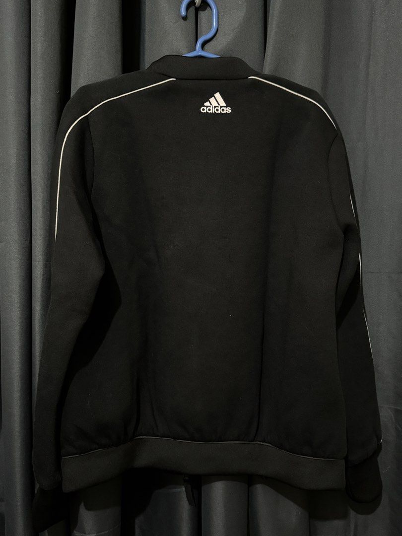 Adidas x Ken ZHE Bomber Jacket Black (Category: Coats, Jackets and Outerwear) located in Iligan City. Submitted by kitkatdeclutters (Listing ID 1457452909, Image 2). Description: - Classic black Adidas bomber jacket - Stylish white piping on sleeves and collar - Convenient zip-up front with pockets - Unique patterned inner lining - Ideal for everyday casual wear.