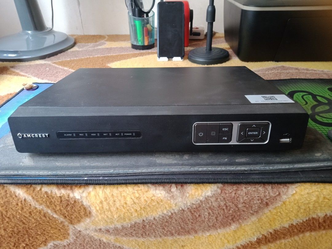 Amcrest DVR/NVR - Black, with 2TB Hard Drive (Category: Security Systems & CCTV Cameras) located in Cainta. Submitted by vinzrulez (Listing ID 1457371764, Image 1). Description: - Amcrest DVR/NVR unit with 2TB hard drive - Sleek black casing - Front panel: Power, ESC, FN, navigation buttons, and USB port - Back panel: Audio In/Out, VGA, HDMI, Ethernet, DC 12V power input - Perfect for building a robust security system.