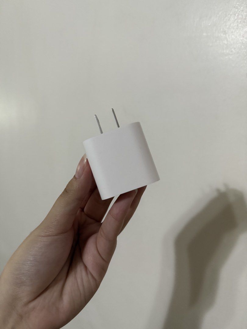 Apple 20W USB-C Power Adapter (Category: Cables & Adaptors) located in Lipa City. Submitted by g_declutters (Listing ID 1457353663, Image 1). Description: From Macbook Neo box. Unused..
