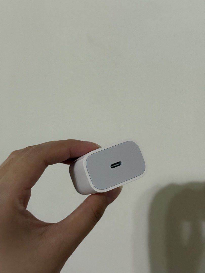 Apple 20W USB-C Power Adapter (Category: Cables & Adaptors) located in Lipa City. Submitted by g_declutters (Listing ID 1457353663, Image 3). Description: From Macbook Neo box. Unused..