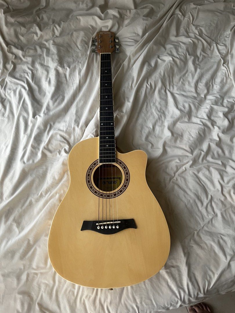 Arena Acoustic Guitar (Category: Musical Instruments) located in Quezon City. Submitted by bykisses (Listing ID 1457475363, Image 2). Description: - Arena acoustic guitar with Bag and capo included! - Natural wood finish - Cutaway body style - 6 strings - Ideal for beginners and intermediate players - Plays well and ready for a new owner.
