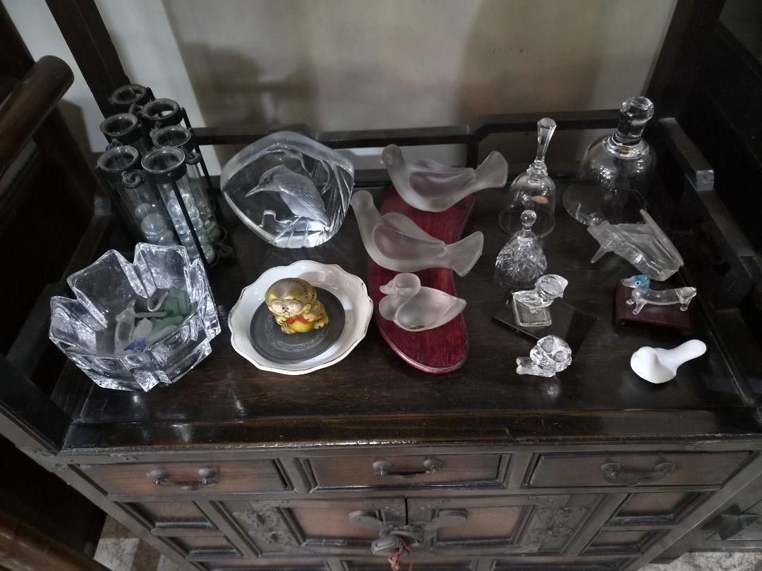 Assorted Ceramic and Glass Decorative Items (Category: Vases & Decorative Bowls) located in Quezon City. Submitted by frankstuff (Listing ID 1457360700, Image 3). Description: - Assorted decorative pieces perfect for display or gifting. - Includes blue and white porcelain teapots, bells, birds, and a large vase. - Features various ceramic bells with unique designs. - Glass figurines of birds and animals add a delicate touch. - Small decorative ho