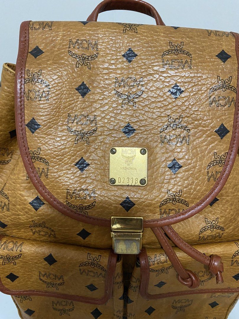 Authentic MCM Bagpack Cognac (Category: Luxury Bags & Wallets) located in Santa Rosa. Submitted by sassycollection. (Listing ID 1457424398, Image 3). Description: In good condition Cognac design Made in Germany Zip closure at the back Multi pocket Unisex.